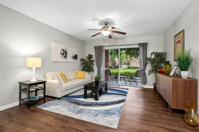a living room with furniture and a large window