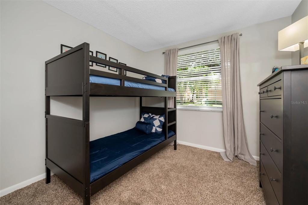 10101 Southwest 14th Street, Unit 2B9202 Pembroke Pines, FL 33025 - Photo 23 of 48 a bedroom with bunk bed and a window