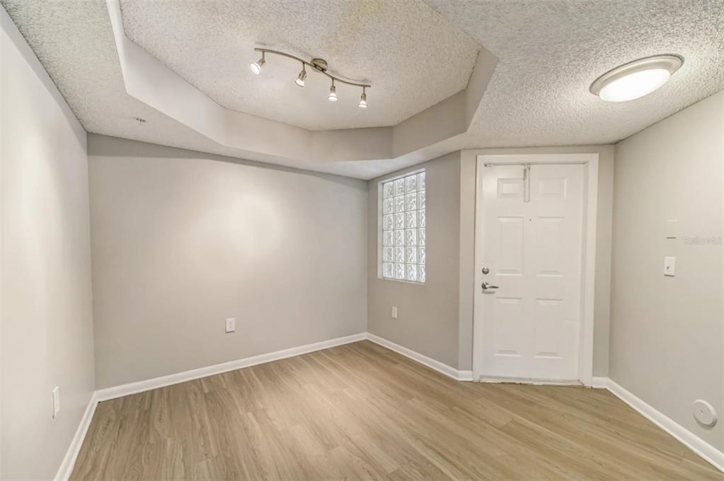 10101 Southwest 14th Street, Unit 2B9202 Pembroke Pines, FL 33025 - Photo 30 of 48 an empty room with wooden floor and windows