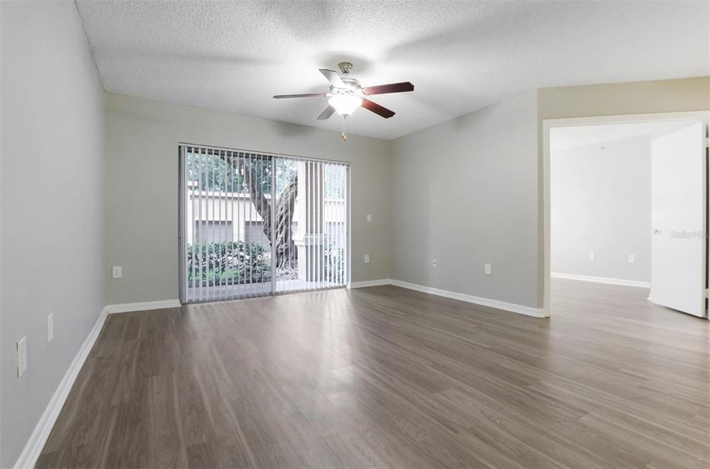 10101 Southwest 14th Street, Unit 2B9202 Pembroke Pines, FL 33025 - Photo 35 of 48 a view of an empty room with wooden floor and a window