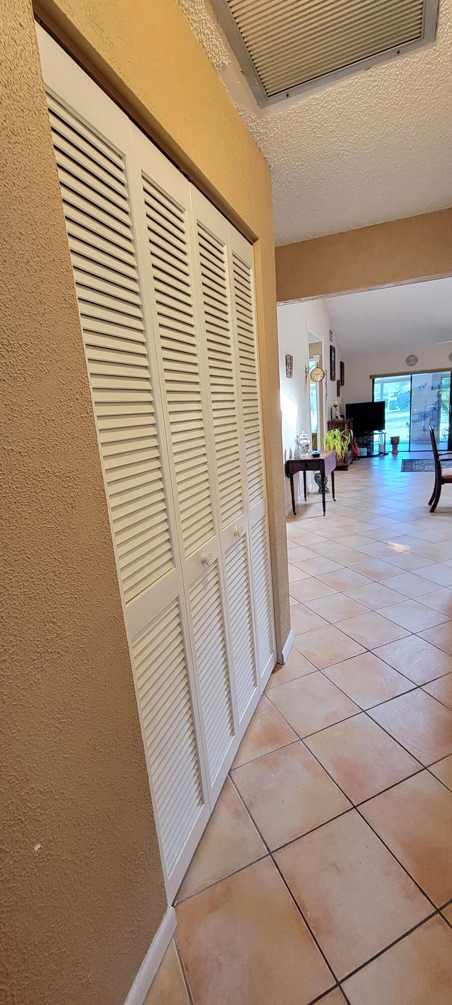 493 Southwest 28th Avenue Delray Beach, FL 33445 - Photo 17 of 48 a view of front door with furniture and a window