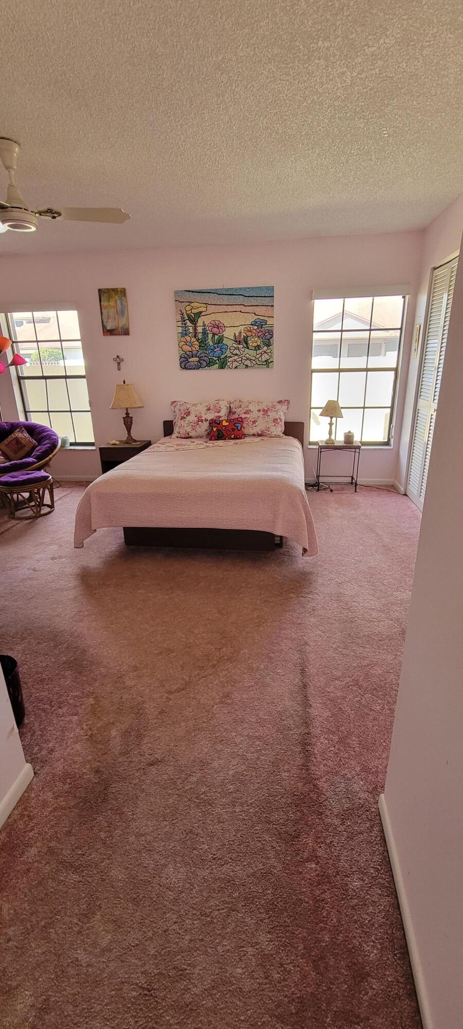 493 Southwest 28th Avenue Delray Beach, FL 33445 - Photo 21 of 48 a bedroom with a bed and window