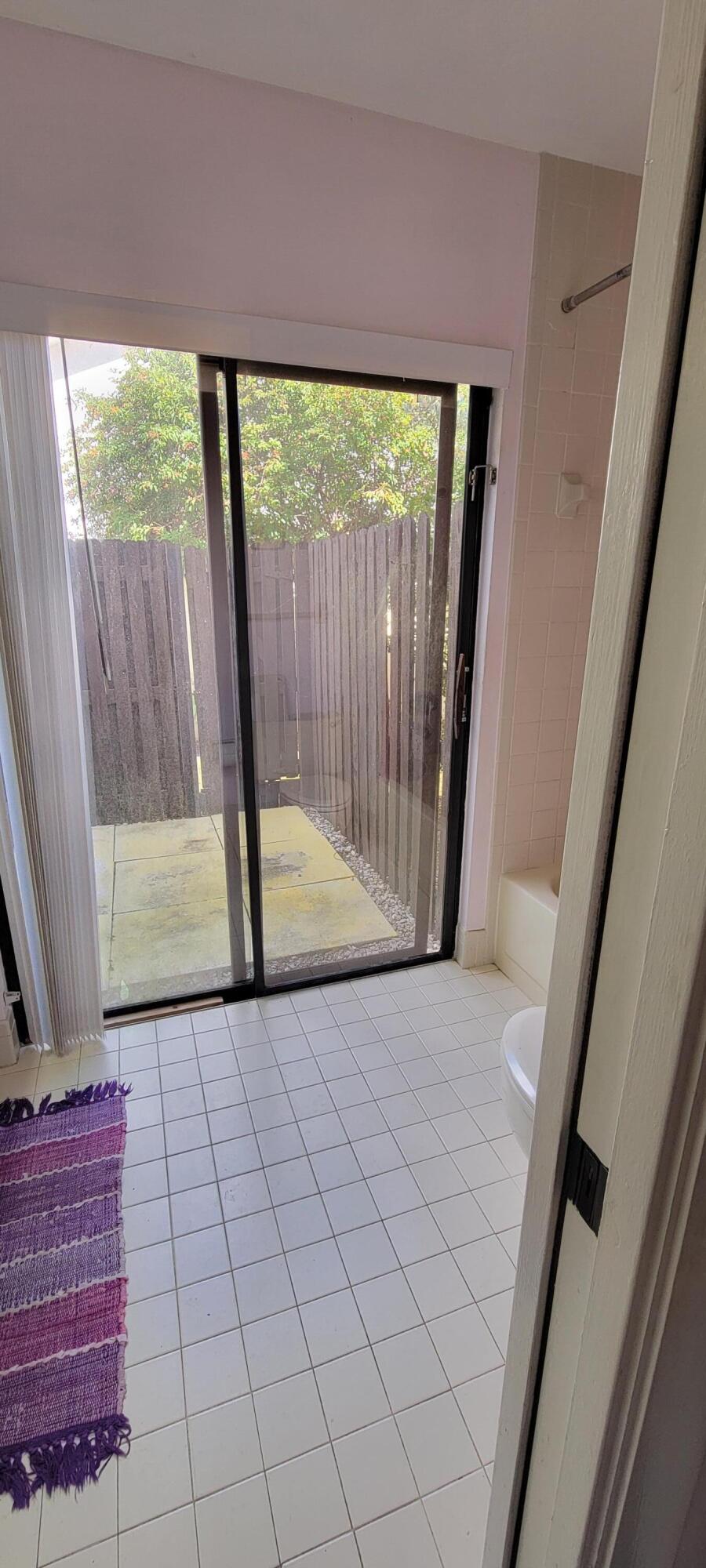 493 Southwest 28th Avenue Delray Beach, FL 33445 - Photo 26 of 48 a view of empty room with wooden floor and fan