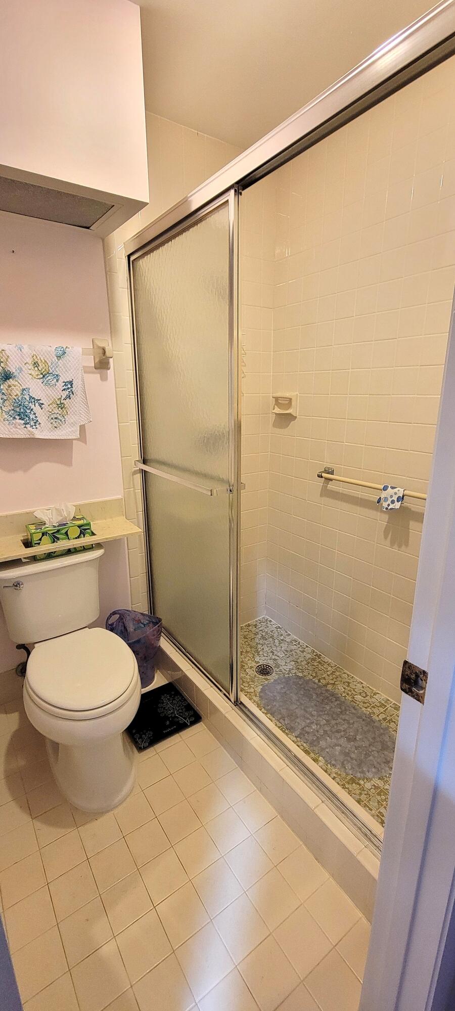 493 Southwest 28th Avenue Delray Beach, FL 33445 - Photo 29 of 48 a bathroom with a toilet and a shower