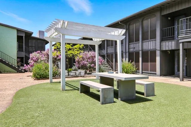 a view of an house with porch and sitting area