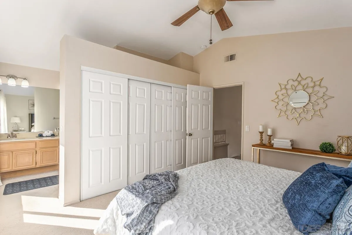 1501 Promontory Ridge Way Vista, CA 92081 - Photo 11 of 22 a bedroom with a bed and a dresser