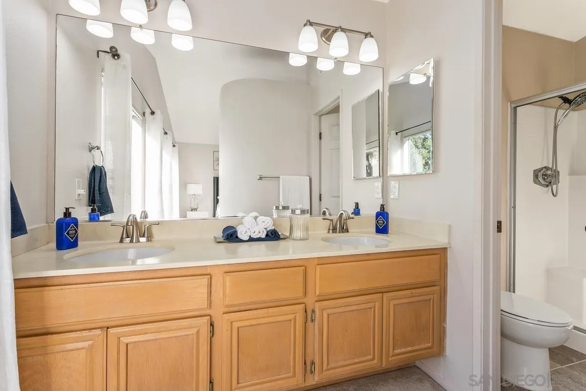 1501 Promontory Ridge Way Vista, CA 92081 - Photo 12 of 22 a bathroom with a sink double vanity and a mirror