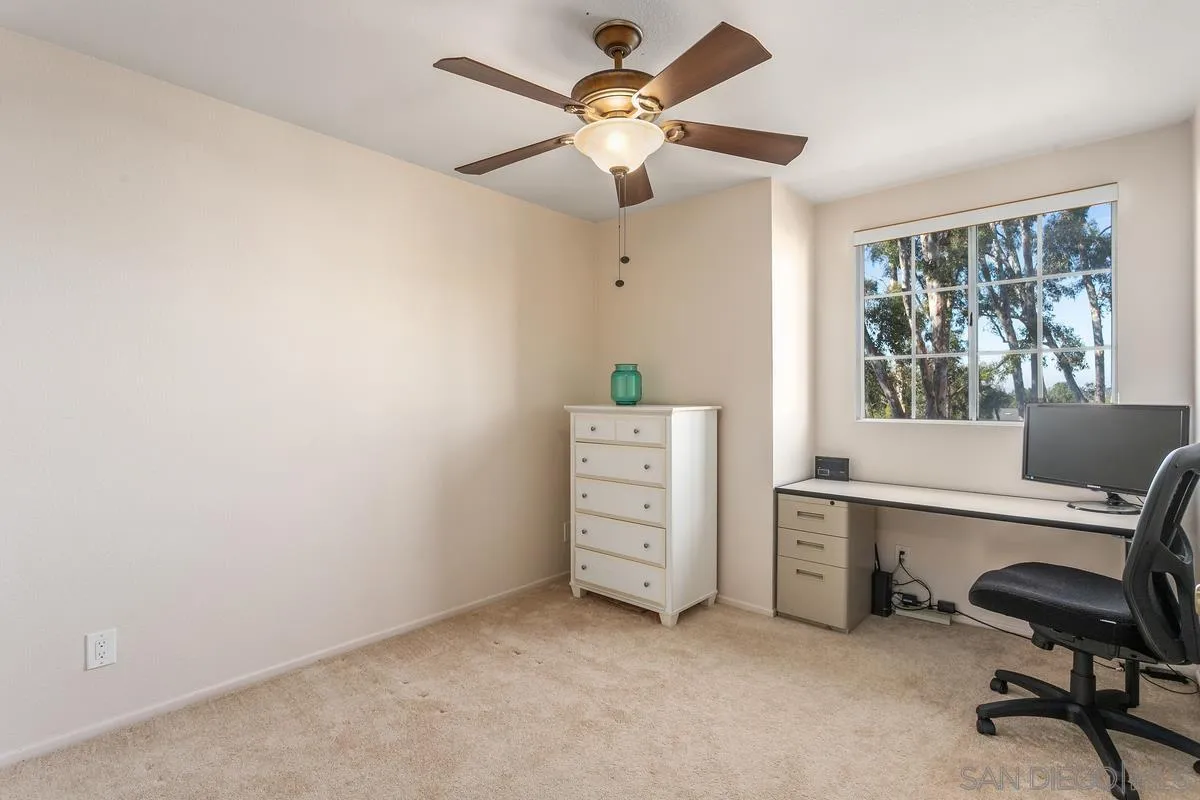 1501 Promontory Ridge Way Vista, CA 92081 - Photo 16 of 22 a view of a workspace with furniture and a window