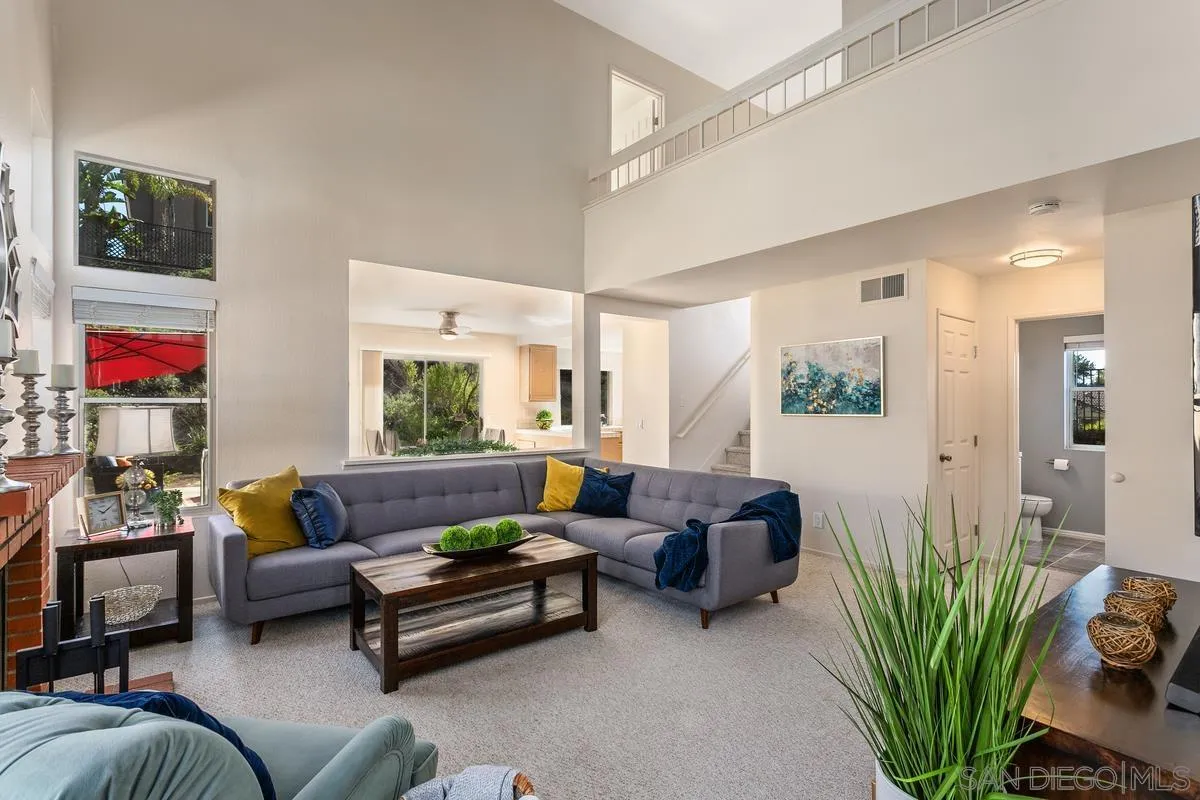 1501 Promontory Ridge Way Vista, CA 92081 - Photo 2 of 22 a living room with furniture a flat screen tv and a potted plant