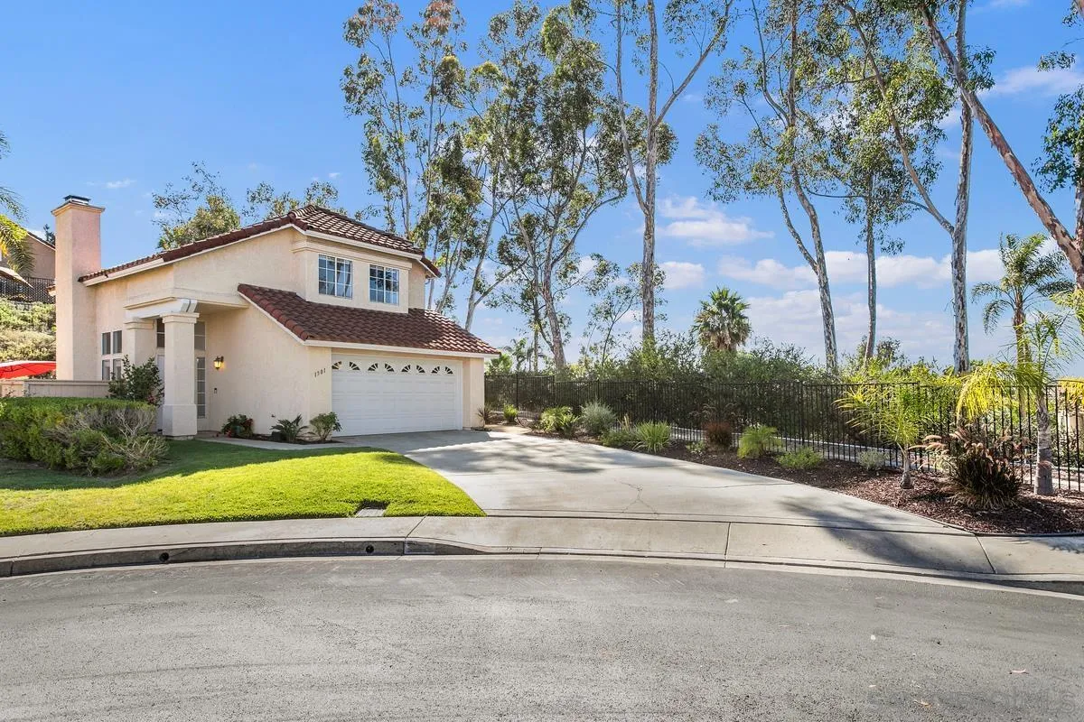 1501 Promontory Ridge Way Vista, CA 92081 - Photo 22 of 22 a front view of a house with a yard and a garage