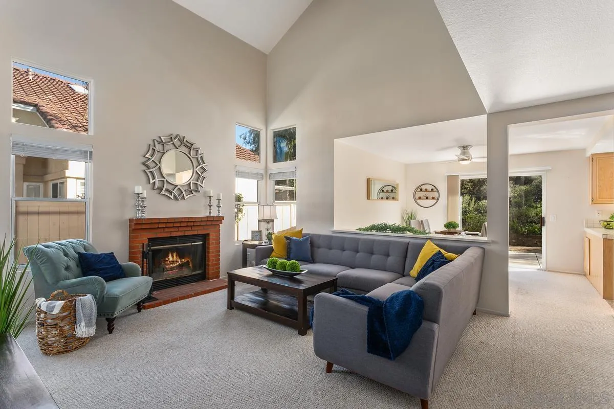 1501 Promontory Ridge Way Vista, CA 92081 - Photo 3 of 22 a living room with furniture and a fireplace