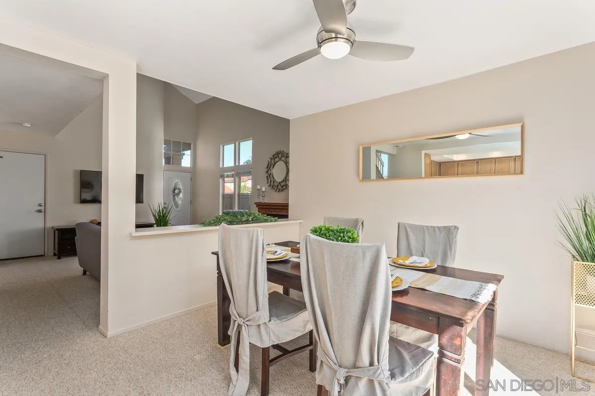 1501 Promontory Ridge Way Vista, CA 92081 - Photo 6 of 22 a view of a dining room with furniture and a chandelier