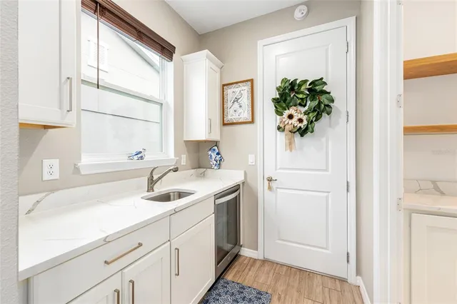 a bathroom with a sink a vanity and a mirror