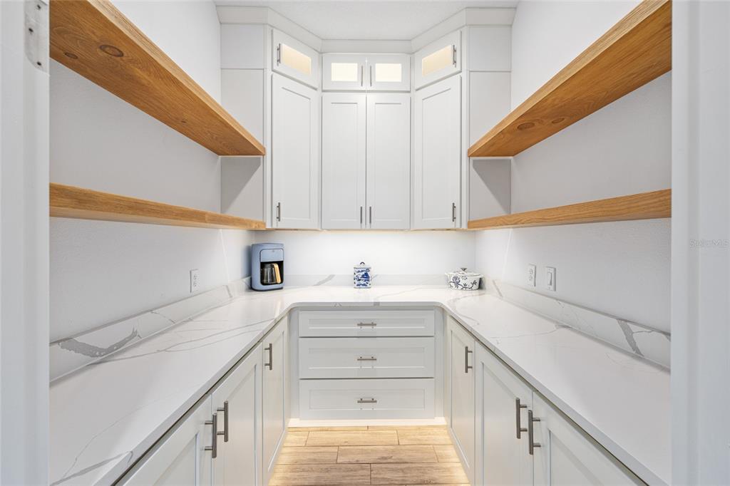 6488 Southwest 78th Court Ocala, FL 34474 - Photo 13 of 40 a view of a kitchen with cabinets appliances and a window