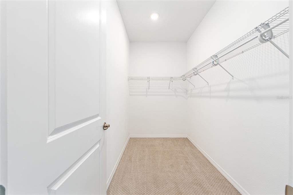 6488 Southwest 78th Court Ocala, FL 34474 - Photo 18 of 40 a view of a room with racks on the wall