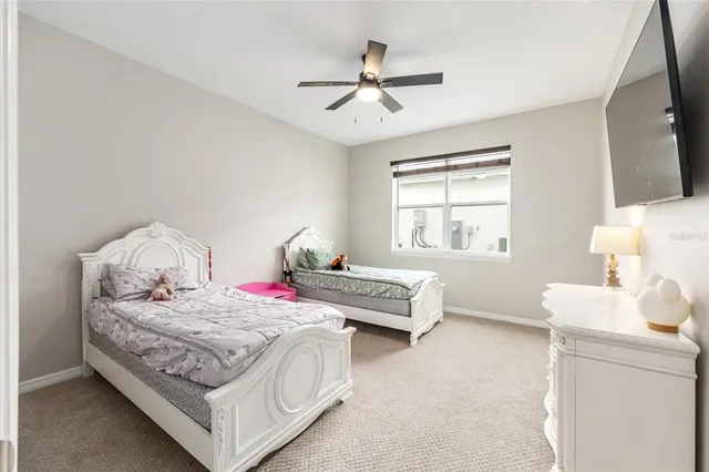 a bedroom with a bed and window