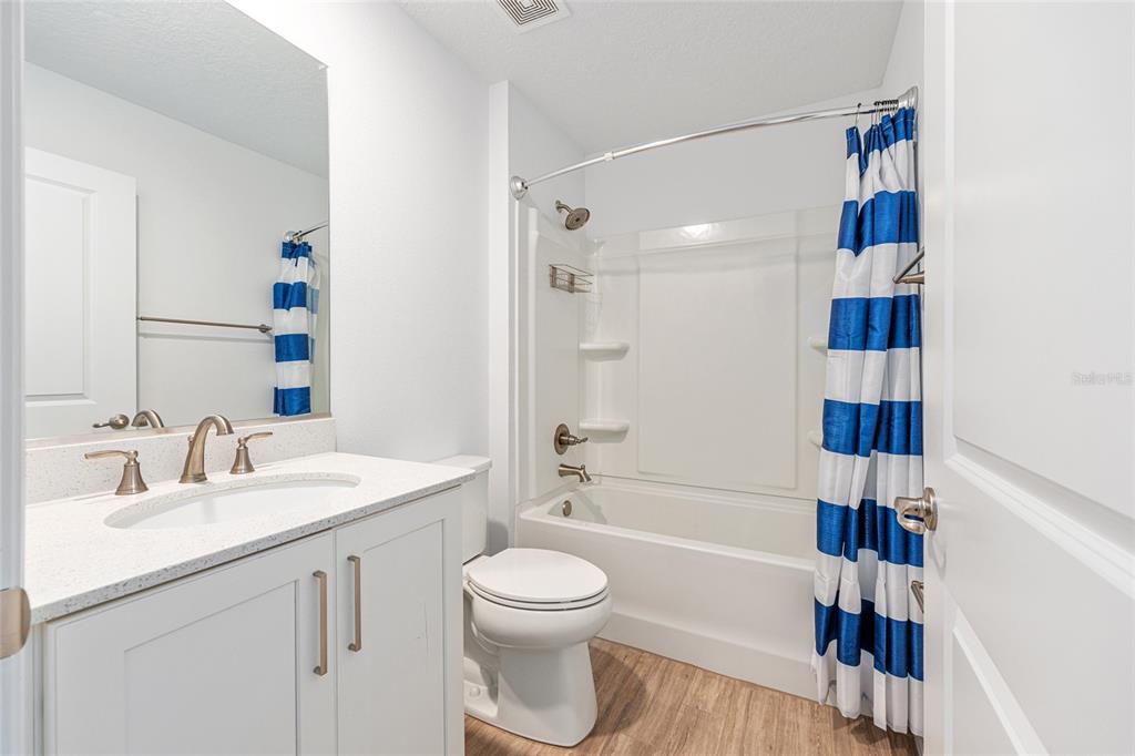 6488 Southwest 78th Court Ocala, FL 34474 - Photo 30 of 40 a bathroom with a sink a toilet and a shower