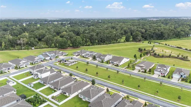 a front view of a house with a yard and porch