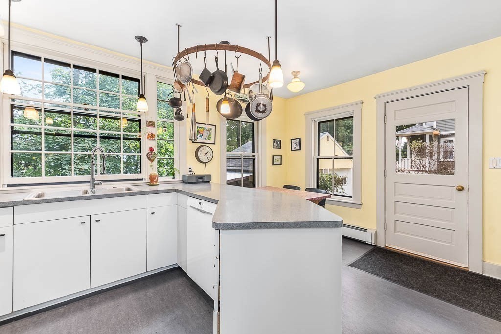56 Clark Street Dedham, MA 02026 - Photo 15 of 42 a very nice looking kitchen with granite countertop a stove and a sink