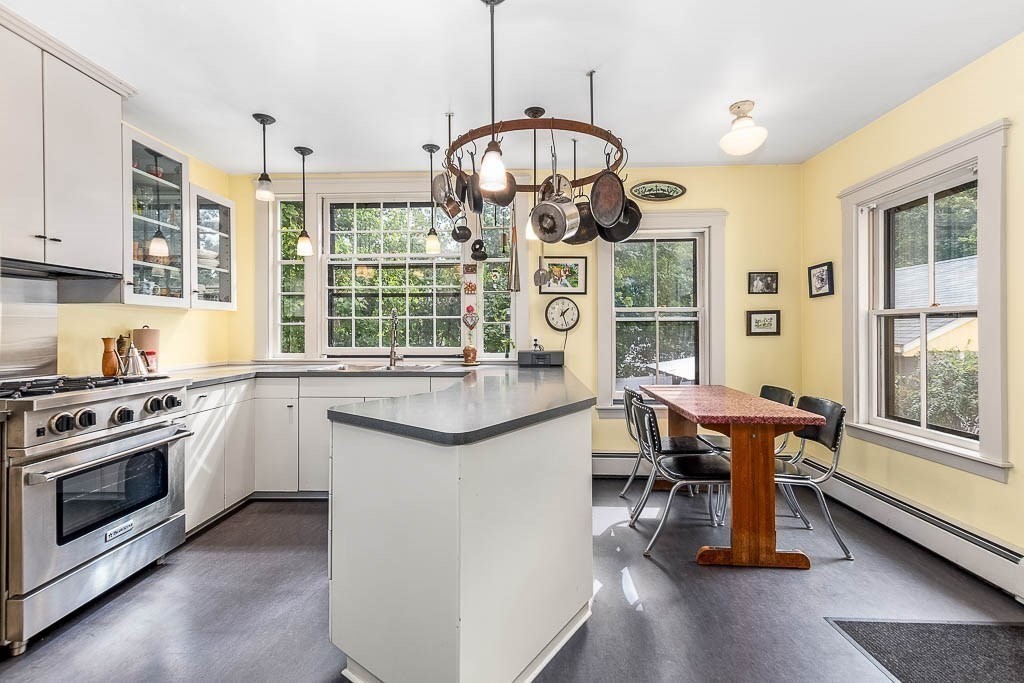 56 Clark Street Dedham, MA 02026 - Photo 16 of 42 a very nice looking kitchen with granite countertop a stove and large window