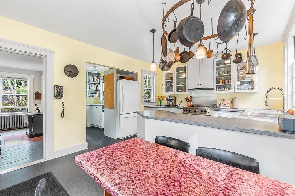 56 Clark Street Dedham, MA 02026 - Photo 19 of 42 a kitchen with stainless steel appliances granite countertop a sink and cabinets