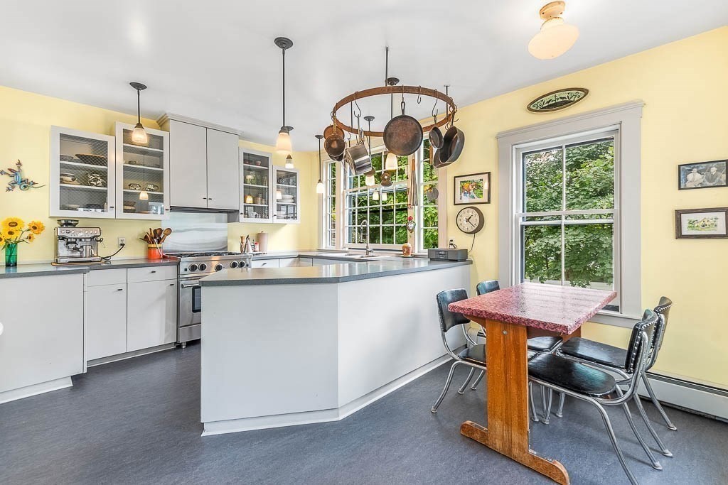 56 Clark Street Dedham, MA 02026 - Photo 21 of 42 a kitchen with a table and chairs in it