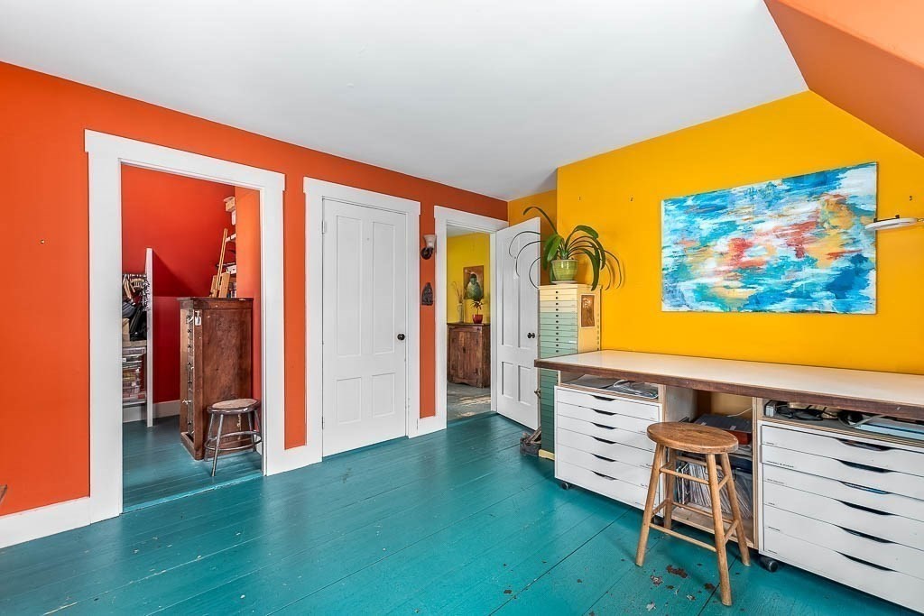 56 Clark Street Dedham, MA 02026 - Photo 24 of 42 a view of a living room with furniture and a flat screen tv