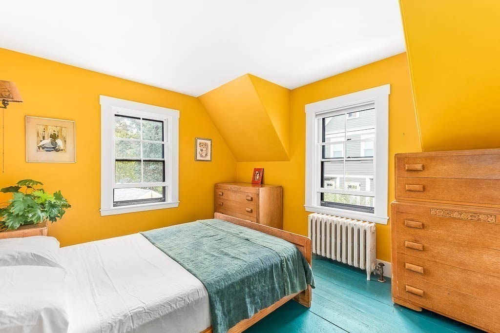 56 Clark Street Dedham, MA 02026 - Photo 26 of 42 a bedroom with a bed and wooden floor