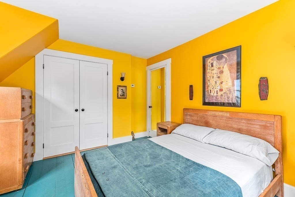 56 Clark Street Dedham, MA 02026 - Photo 27 of 42 a bedroom with a bed and wooden floor