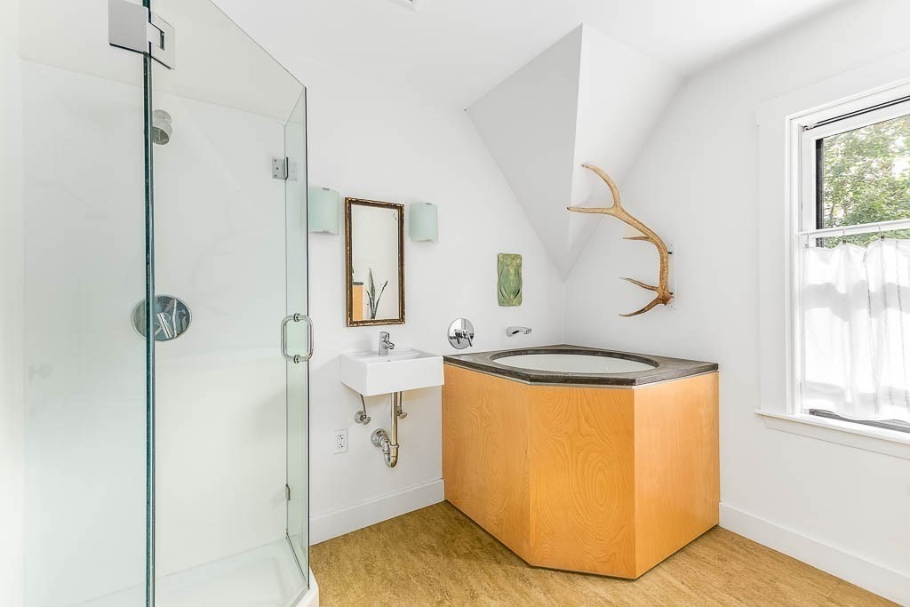 56 Clark Street Dedham, MA 02026 - Photo 28 of 42 a bathroom with a tub sink a mirror and shower