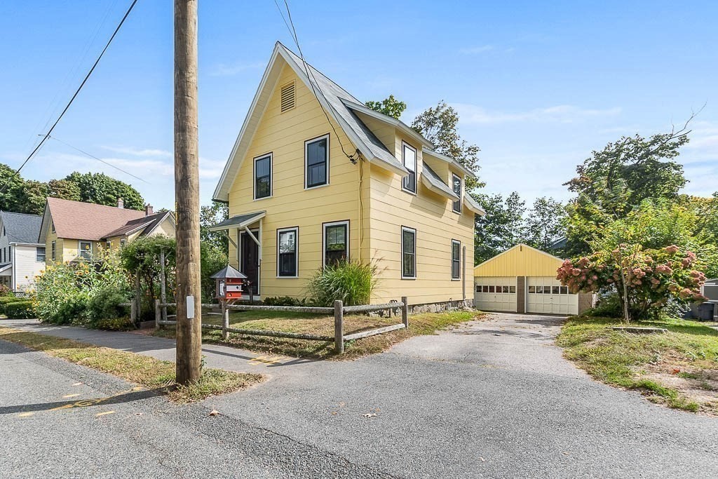 56 Clark Street Dedham, MA 02026 - Photo 3 of 42 a view of a house with backyard and road