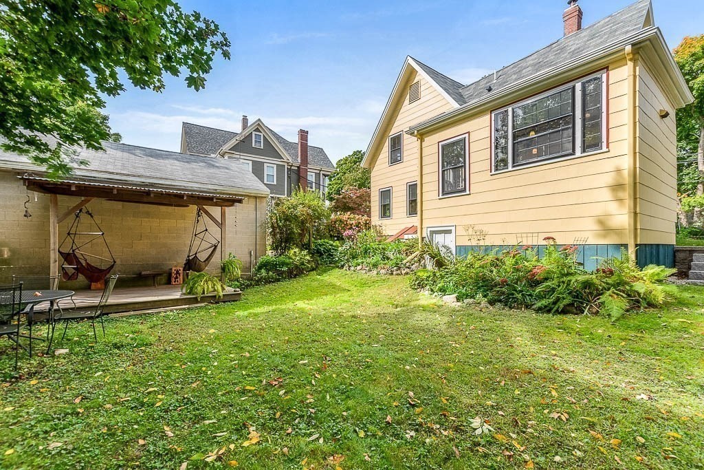 56 Clark Street Dedham, MA 02026 - Photo 37 of 42 a view of a house with backyard and sitting area