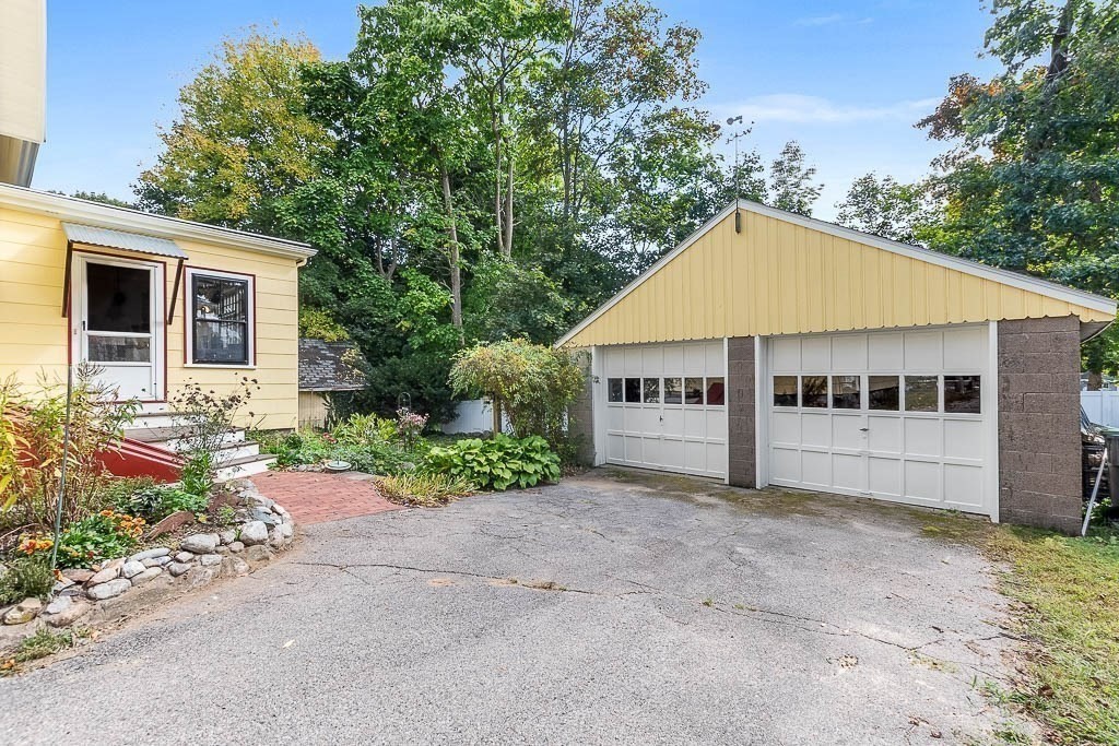 56 Clark Street Dedham, MA 02026 - Photo 38 of 42 front view of a house with a yard