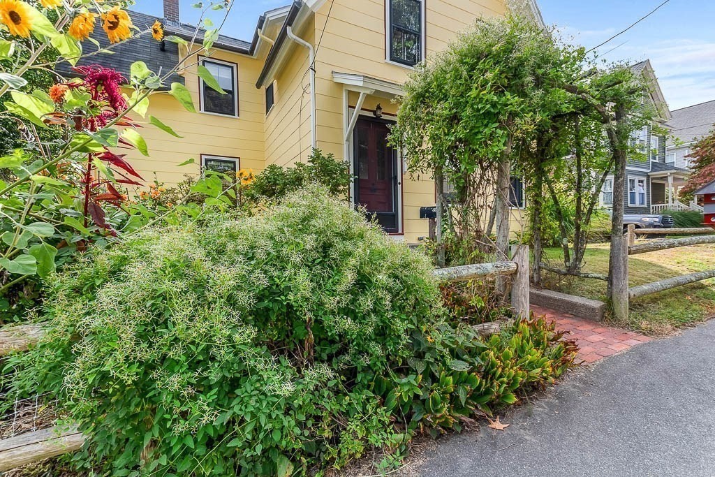 56 Clark Street Dedham, MA 02026 - Photo 4 of 42 front view of a house with a tree
