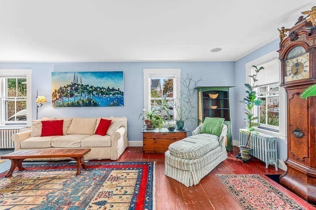 56 Clark Street Dedham, MA 02026 - Photo 6 of 42 a living room with furniture and a rug