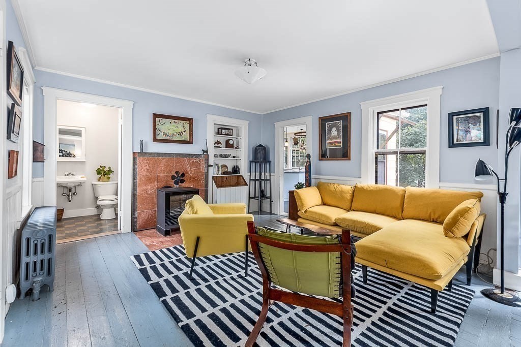 56 Clark Street Dedham, MA 02026 - Photo 10 of 42 a living room with furniture and a wooden floor