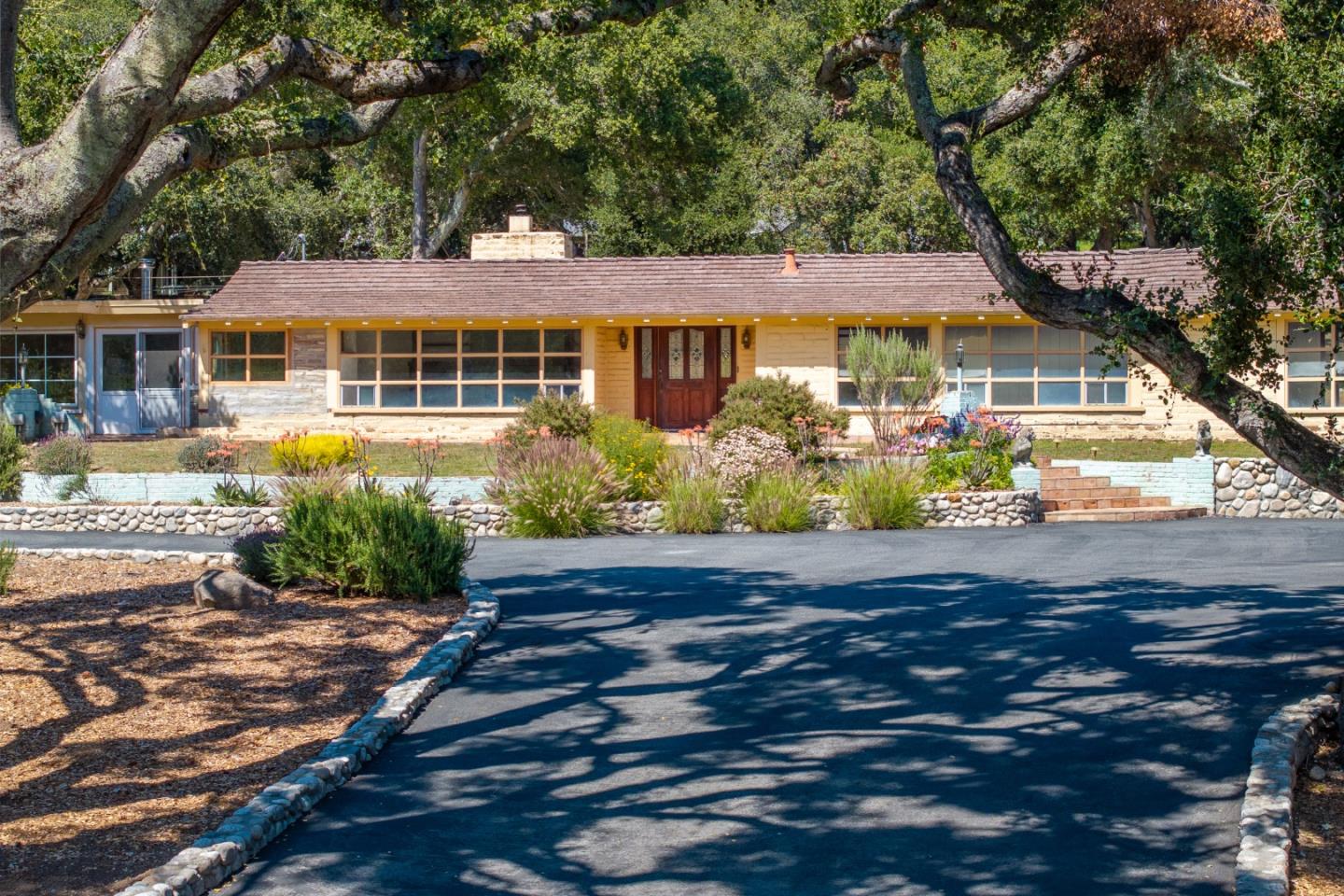 72 Los Laureles Grade Road Carmel Valley, CA 93924 - Photo 1 of 43 front view of a house with a yard