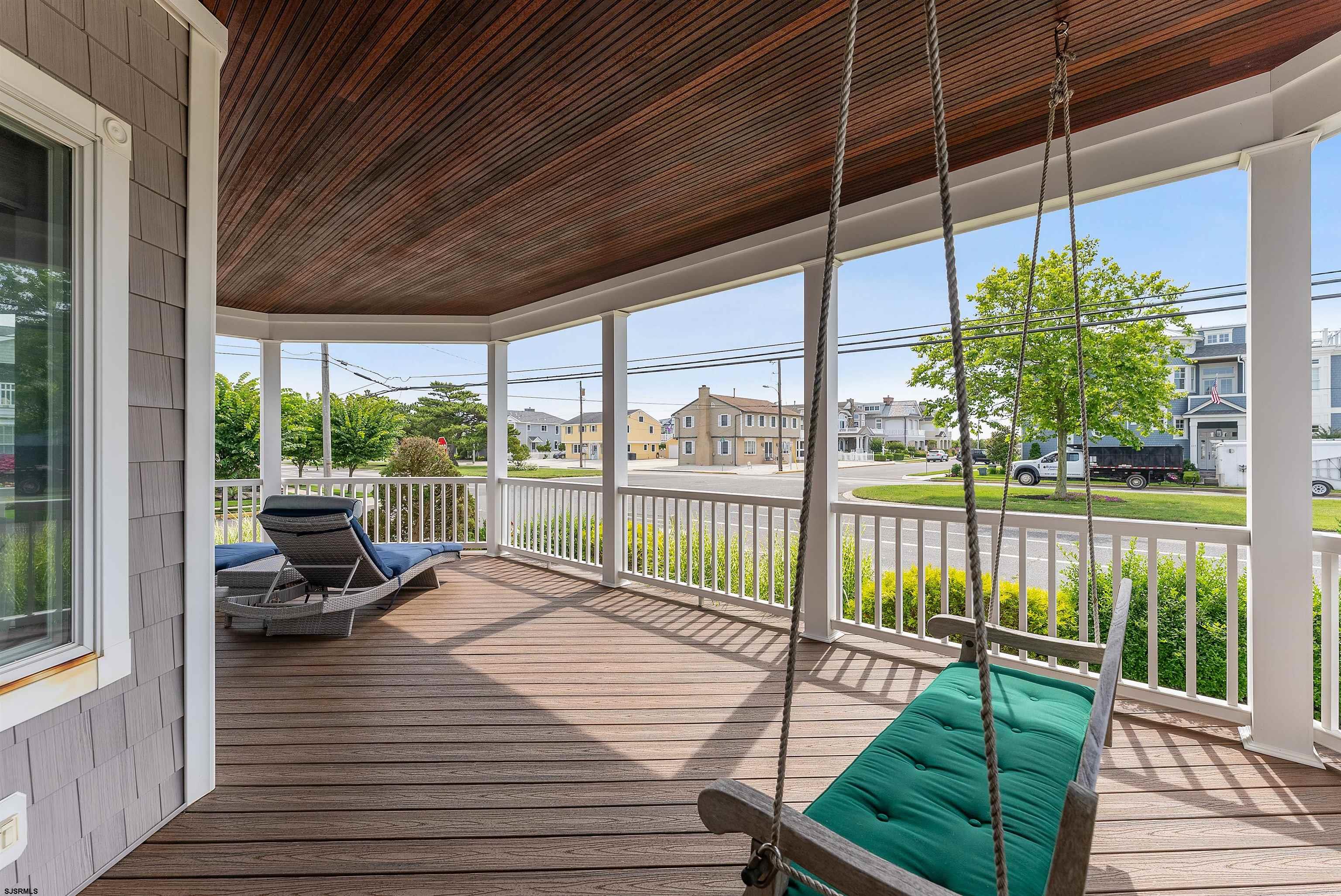 11901 2nd Avenue Stone Harbor, NJ 08247 - Photo 17 of 40 a view of a balcony with lake view and a floor to ceiling window with wooden floor