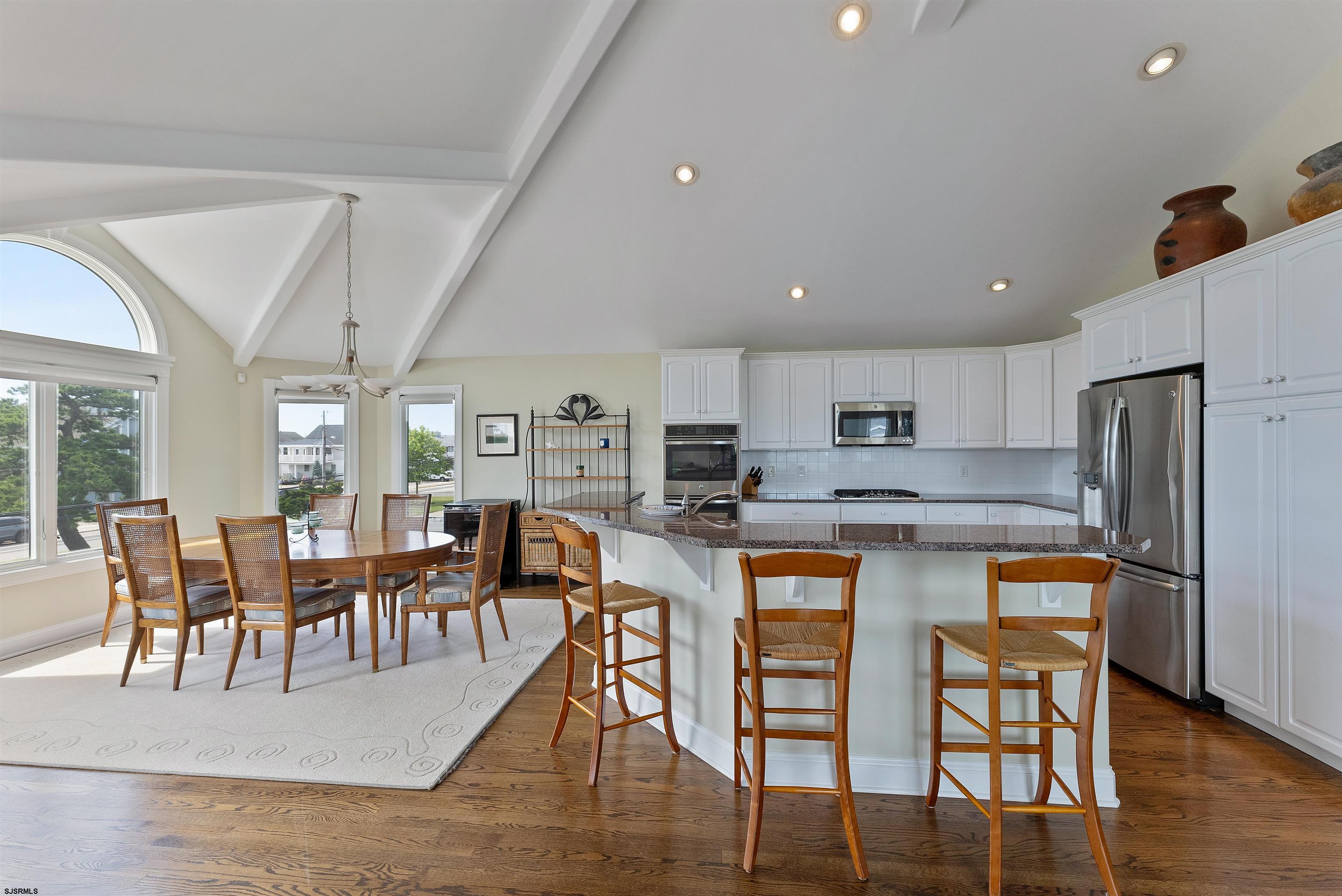 11901 2nd Avenue Stone Harbor, NJ 08247 - Photo 26 of 40 a large kitchen with a table and chairs