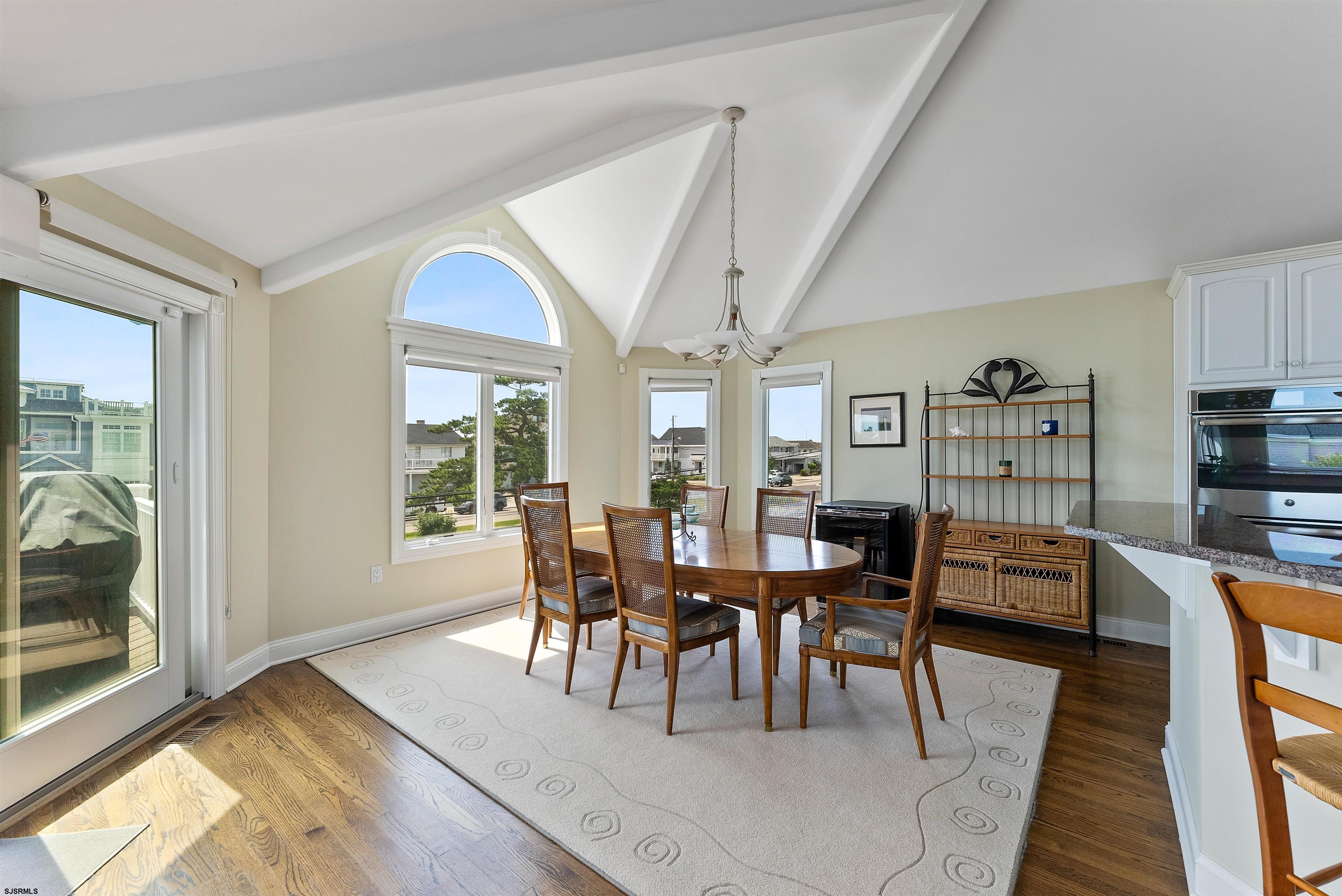 11901 2nd Avenue Stone Harbor, NJ 08247 - Photo 28 of 40 a view of a dining room with furniture window and wooden floor
