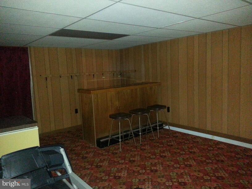 11410 Airport Road Waynesboro, PA 17268 - Photo 12 of 14 a room with wooden furniture and a chair