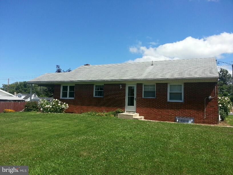 11410 Airport Road Waynesboro, PA 17268 - Photo 13 of 14 a front view of a house with a garden and yard