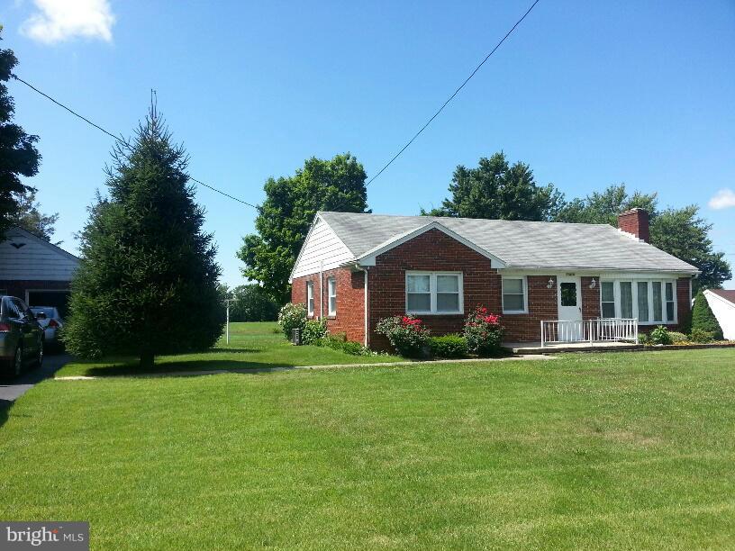 11410 Airport Road Waynesboro, PA 17268 - Photo 2 of 14 a front view of a house with a yard