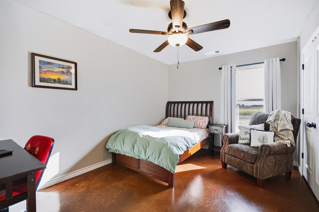 2433 Trlica Road West, TX 76691 - Photo 20 of 40 Guest Room 2Hard-surface flooring and ceiling fan with integrated lighting
