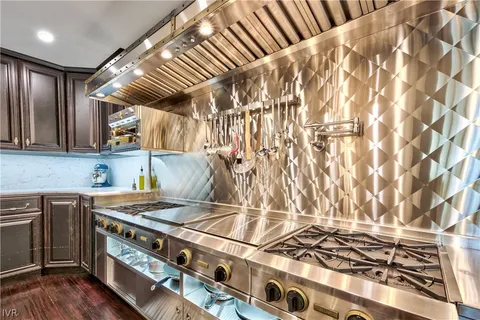 a kitchen with a stove and a shower