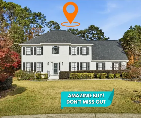 a front view of residential houses with yard and swimming pool