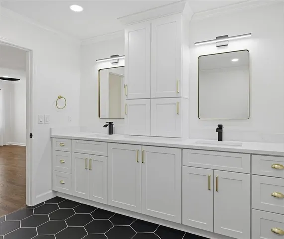 a bathroom with a double vanity sink and mirror