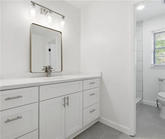 a bathroom with a sink and a toilet