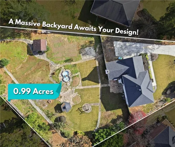 a view of a house with pool and a yard