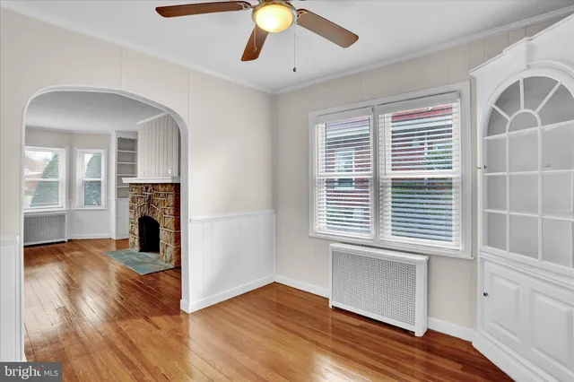 a view of livingroom with hardwood floor and a ceiling fan
